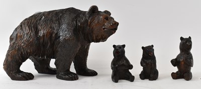 Lot 307 - A carved Black Forest bear, length 26cm,...