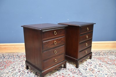 Lot 254 - STAG MINSTREL; a pair of four drawer bedside...