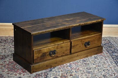 Lot 222 - A modern hardwood TV stand with two base...