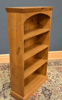 Lot 221 - A pine freestanding bookcase with moulded...