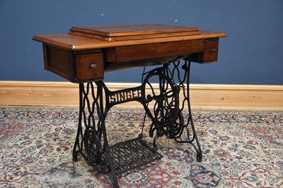 Lot 403 - SINGER; a vintage treadle sewing machine base,...