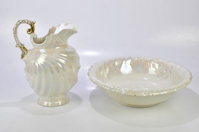 Lot 1409 - An oval opalescent wash jug and bowl, height...