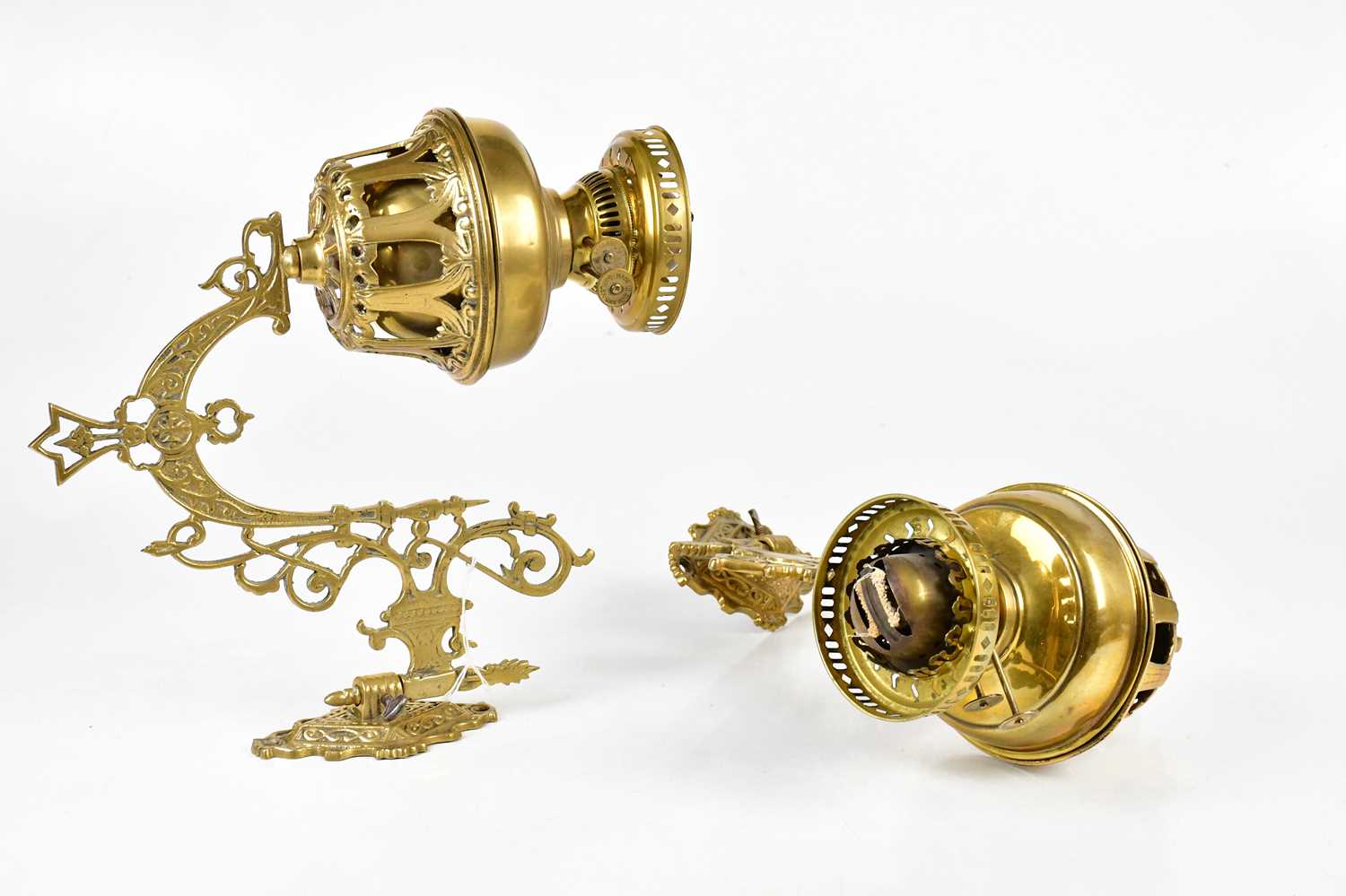Lot 2239 - A pair of brass wall mounted oil lamps, 33cm.