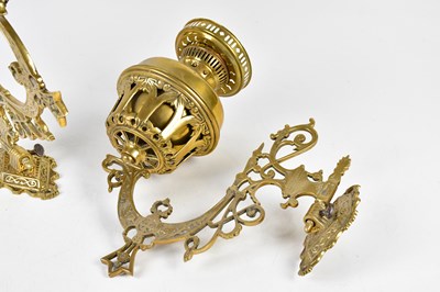 Lot 2239 - A pair of brass wall mounted oil lamps, 33cm.