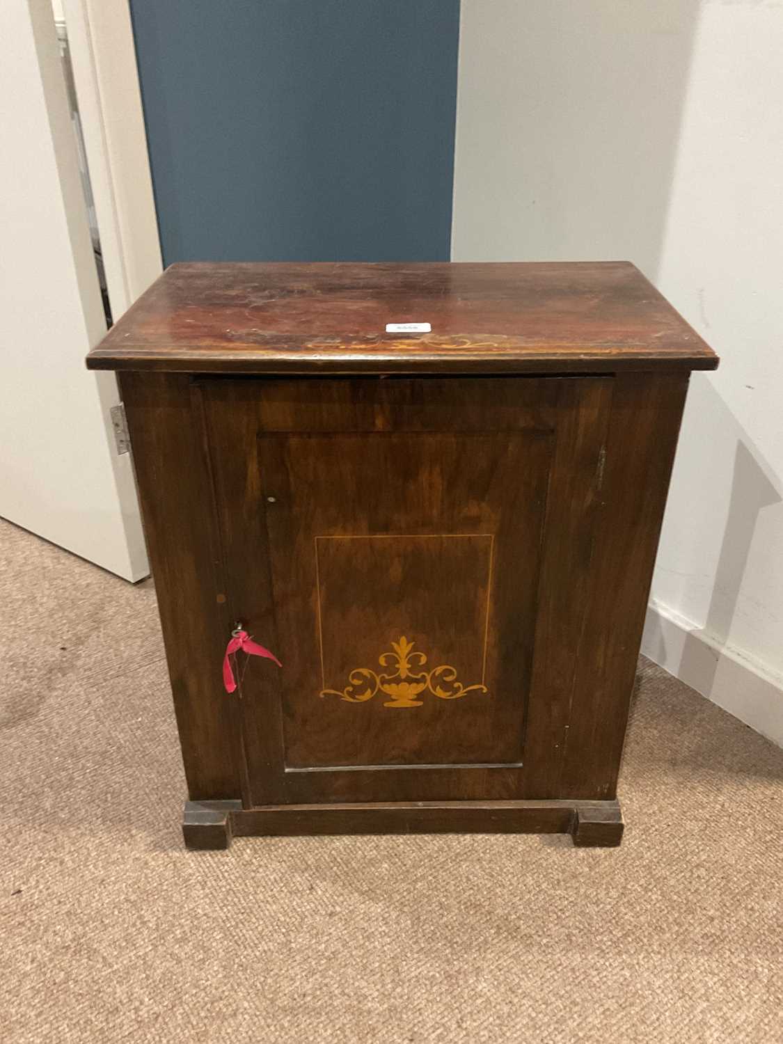 Lot 6558 - An Edwardian inlaid cabinet with single door.