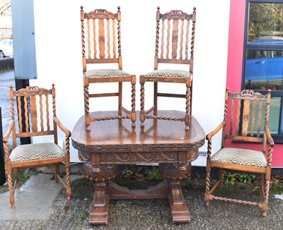 Lot 21 - A 1920s oak dining table with acorn support...