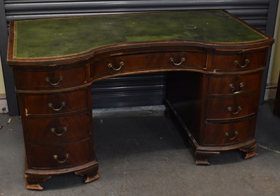 Lot 24 - A reproduction mahogany knee-hole desk with...