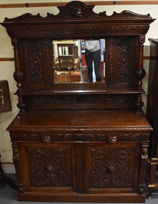 Lot 22 - A large 19th century carved oak mirror back...