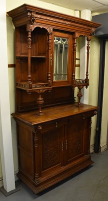 Lot 23 - A large early 20th century oak cupboard, the...