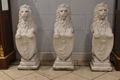 Lot 142 - A group of three white painted stone lions,...