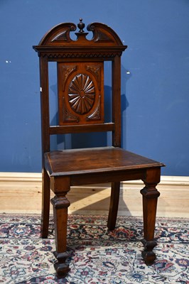 Lot 83 - An early 20th century carved oak hall chair in...