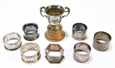 Lot 2544 - A collection of three hallmarked silver napkin...