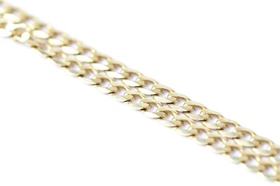 Lot 1100 - A 9ct yellow gold flat curb link chain, length...