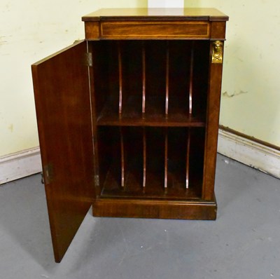 Lot 20 - A Regency rosewood single door music cabinet...