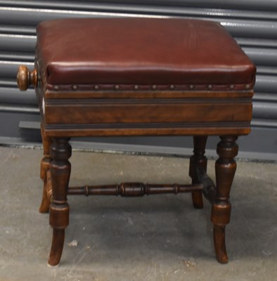 Lot 71 - An Edwardian walnut adjustable piano stool on...