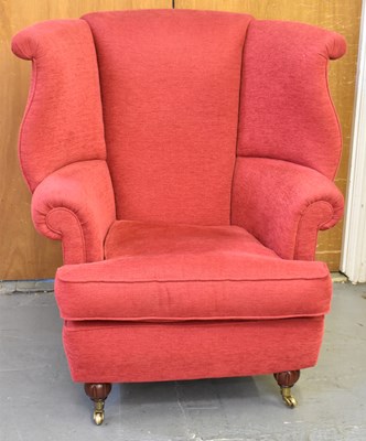 Lot 14 - A good reproduction red upholstered wing...