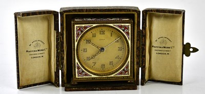 Lot 6404 - KINZEL; a miniature travelling alarm clock,...