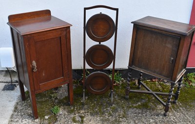 Lot 88 - A 1920s oak bedside cupboard on barley twist...