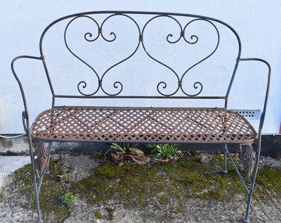 Lot 147 - A wrought iron foldable garden bench, width...