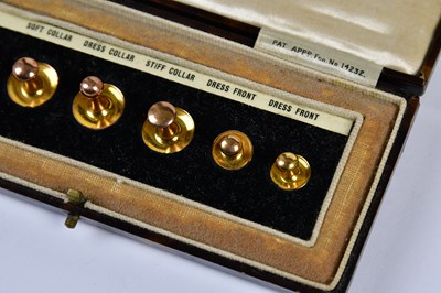 Lot 1144 - A cased set of six 9ct gold shirt studs,...