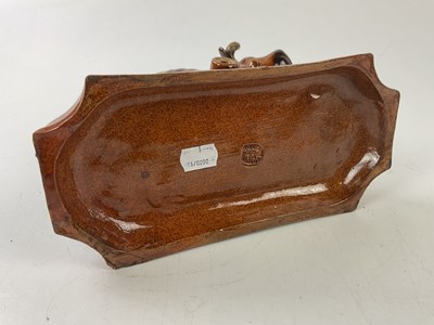 Lot 5378 - An unusual treacle glazed ceramic model of a...