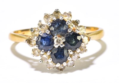 Lot 1145 - An 18ct yellow gold diamond and sapphire...