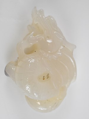 Lot 582 - A 20th century Chinese white jade carving of a...