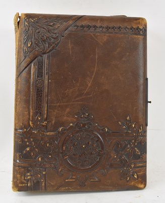 Lot 403 - A late 19th/early 20th century leather bound...