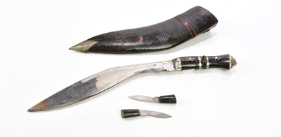 Lot 1630 - A 20th century Kukri knife and scabbard.