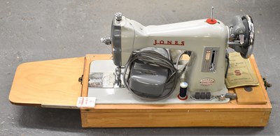 Lot 339 - A cased sewing machine.