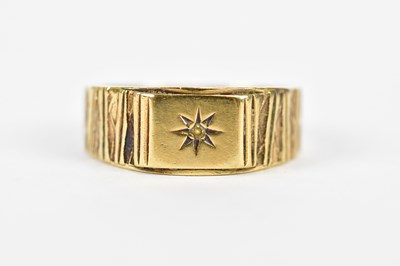 Lot 219 - A 9ct yellow gold signet ring with bark effect...