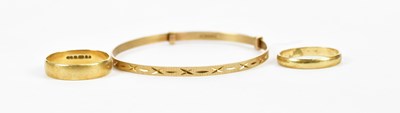 Lot 161 - A 9ct yellow gold ring with engraved...