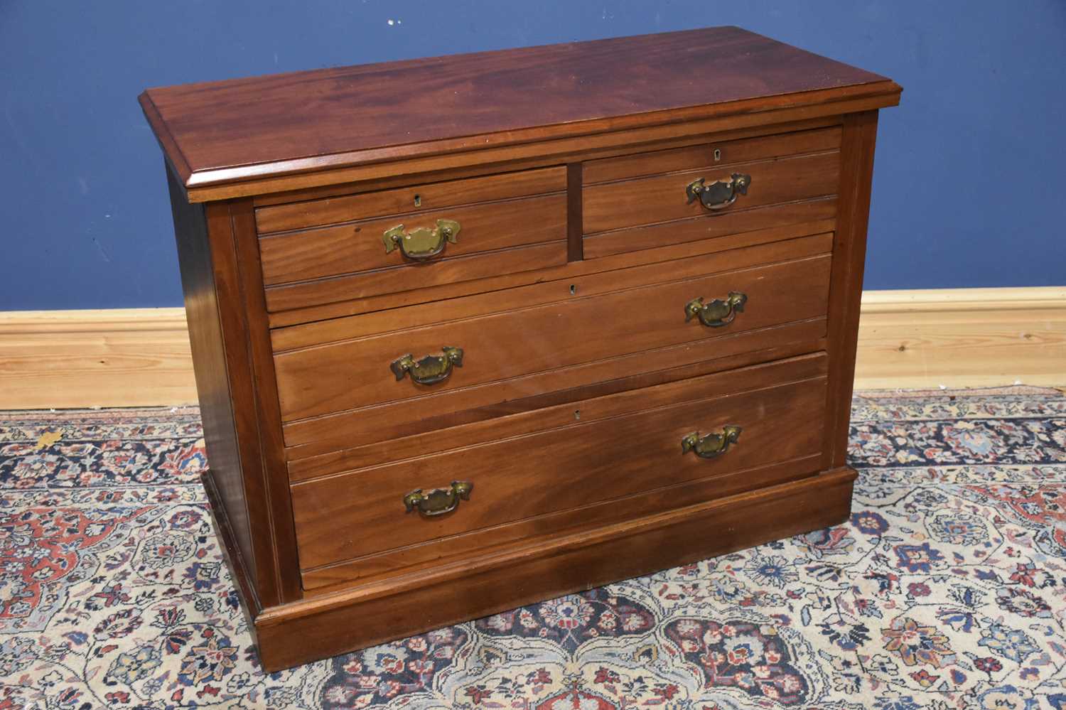 Lot 19 - A Edwardian walnut chest of two short over two...
