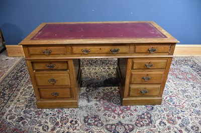 Lot 31 - An early 20th century oak pedestal desk with...