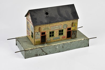 Lot 4348 - BING; a 1930s tin plate railway platform...