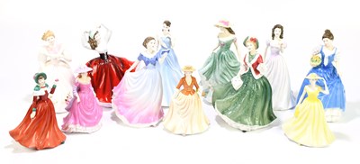 Lot 744 - ROYAL DOULTON; a collection of twelve figures...