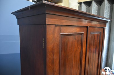 Lot 6 - A 19th century mahogany linen press, the two...