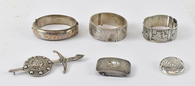 Lot 954 - A hallmarked silver bangle, diameter 6cm,...