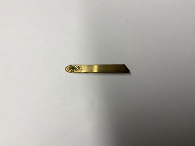 Lot 952 - A pair of 9ct yellow gold tweezers set with...