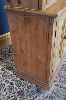 Lot 157 - A pine bookcase, with two glazed doors above...