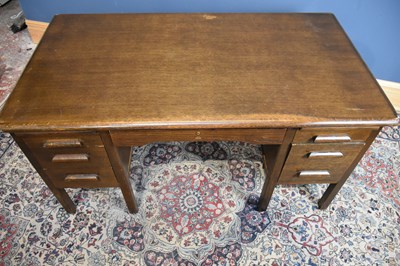 Lot 42 - ABBESS; an oak knee-hole desk, with an...