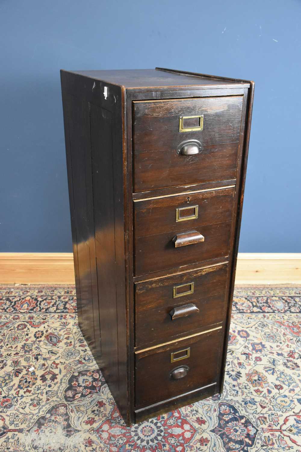 Lot 16 - An early 20th century four drawer oak filing...