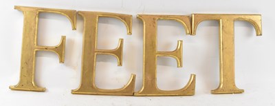 Lot 330 - FEET; a group of four gilt decorated letters.