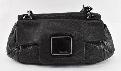 Lot 441 - CALVIN KLEIN; a black leather handbag with...