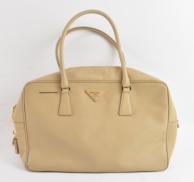 Lot 431 - PRADA; a lady's beige leather handbag with...