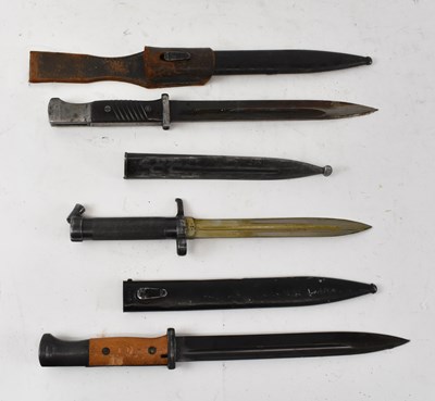 Lot 380 - A group of three WWII bayonets, the largest...