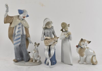 Lot 563 - NAO; four ceramic figures, one of a cat,...