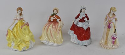 Lot 520 - ROYAL DOULTON; a group of four ceramic figures...