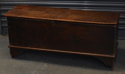 Lot 72 - An early 19th century oak coffer with lift-up...