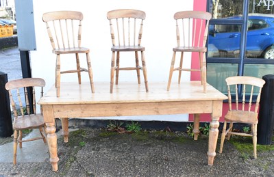 Lot 34 - A pine kitchen dining table on turned supports,...